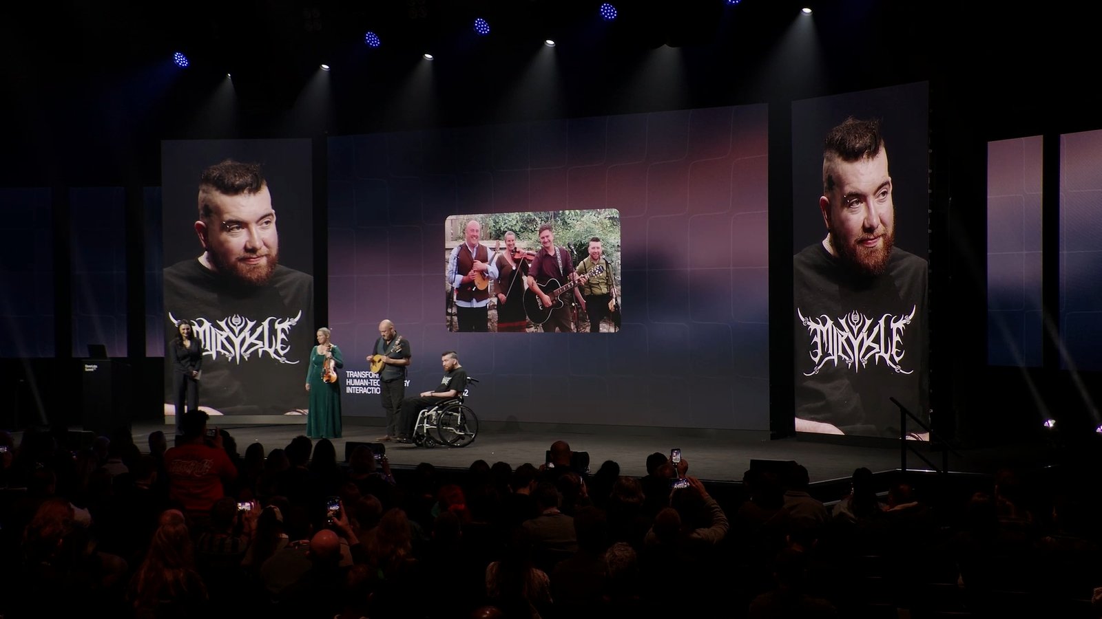 still from live performance at the ElevenLabs Summit with Patrick and band members on stage with Gabi Leibowitz