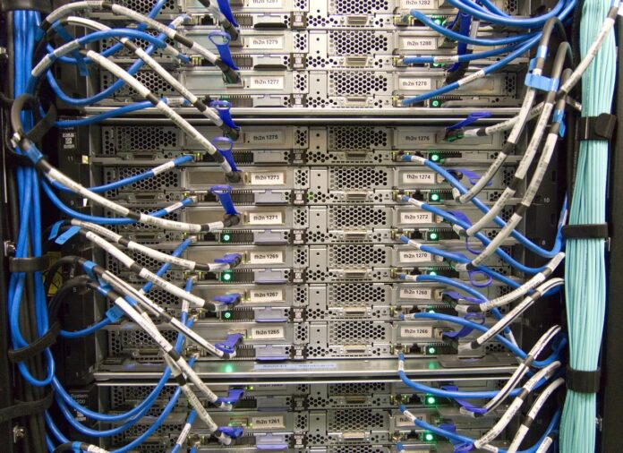 data-center-servers Close-up of server racks with network cables connected in a data center